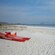 A raft on an unspoiled beach with fine sand